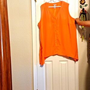 Lady's coral colored blouse.